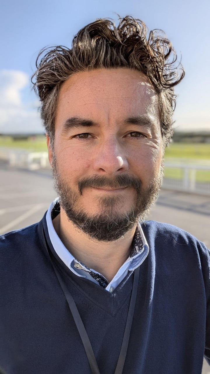 Headshot of Adrian James